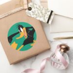 DAFFY DUCK™ Swinging A Punch Classic Round Sticker