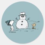 Peanuts Snoopy Builds A Snowman Classic Round Sticker