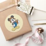 Sporty Mickey Holding Football Classic Round Sticker