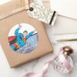 Superman Flies Thru City Classic Round Sticker